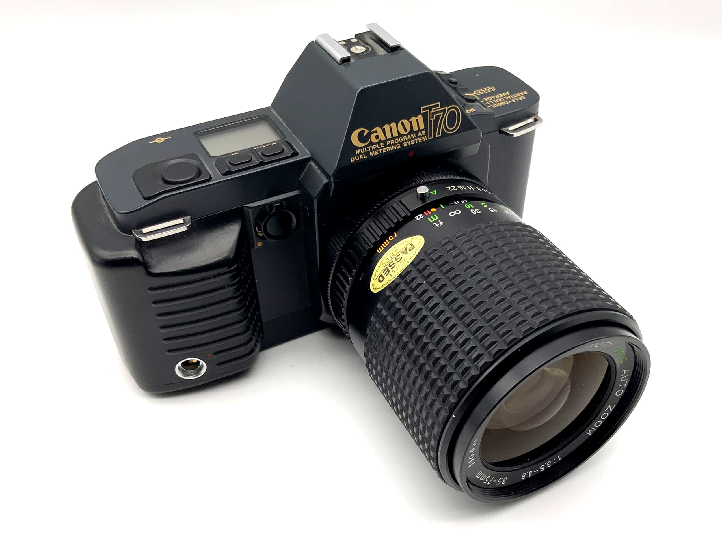 Appareil photo reflex analogique Canon T70 avec objectif Ozunon GMC 1:3,5-4,8 35-75 mm