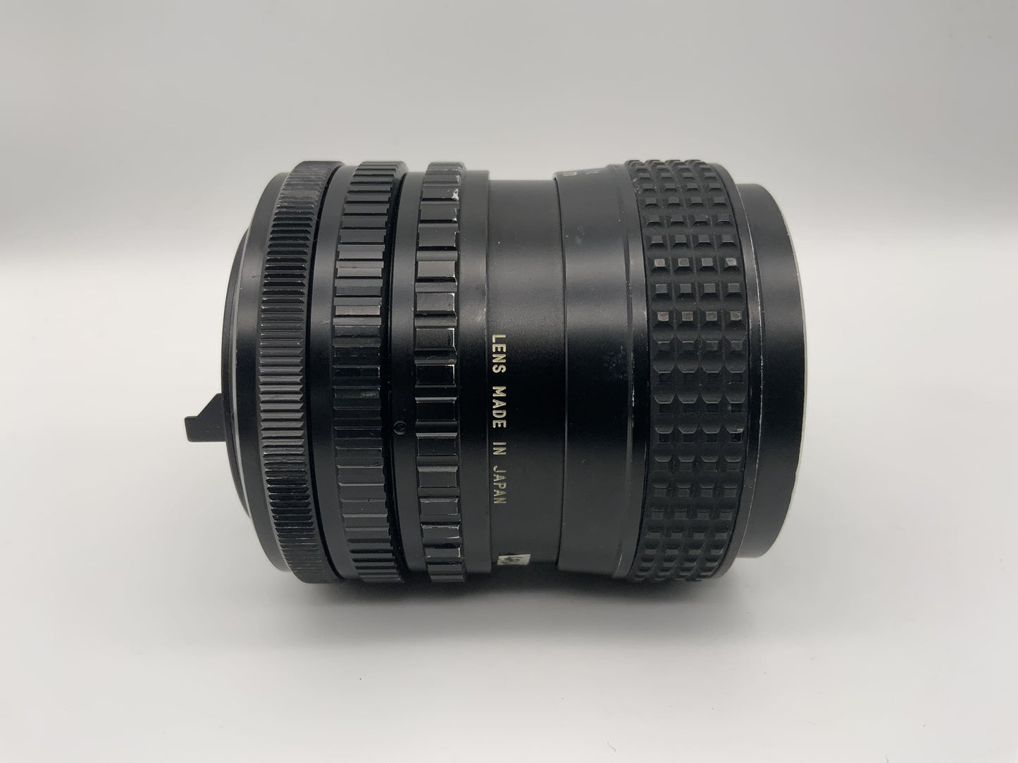 Tokina 25-50mm 1:4 Objektiv  RMC Kamera Lens (Canon FD) Nebel!